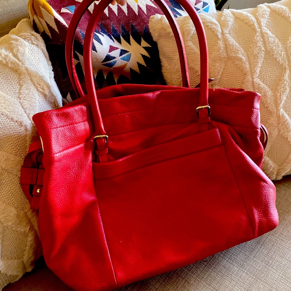 Kate Spade bag lightly used, striped detailing inside.